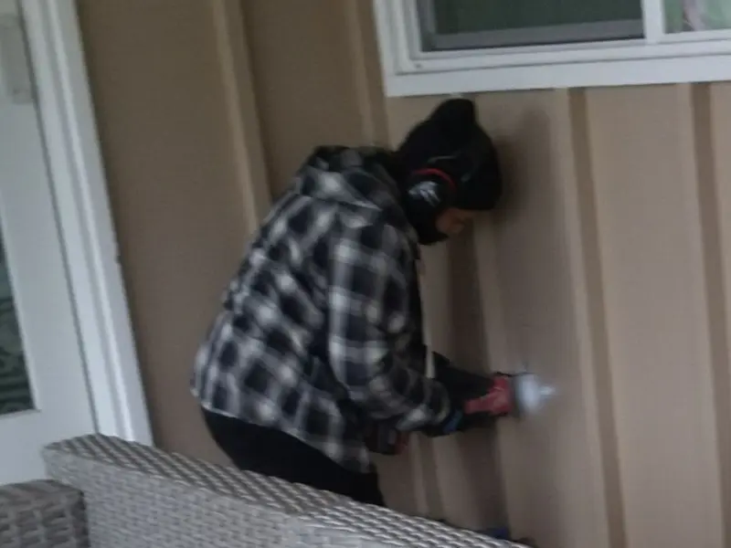 Professional electrician installing an exterior outlet in Levant
