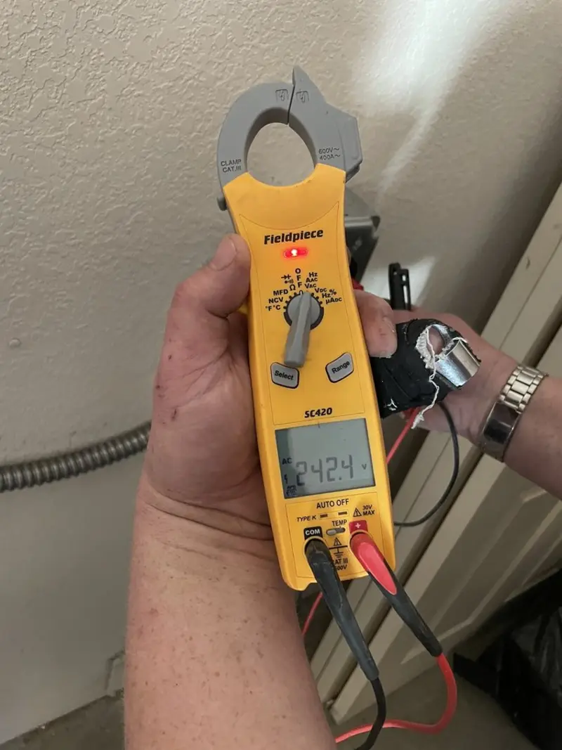 Voltage testing with clamp meter during Electrical Installation Services in Levant
